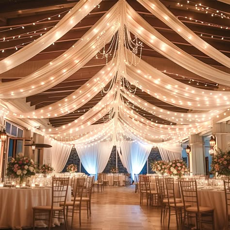 PRICES MAY VARY. 6-Pack Ceiling Drapes for Weddings: 6 panels champagne ceiling drapes for weddings, each ceiling draping fabric measure for 5 feet width x 10 feet length. Come with curtains light string, turn any empty room into a party-ready venue is to decorate with beautiful, flowy layers of floor to ceiling drapes! Wedding Ceiling Drapes: Made of WRINKLE FREE premium sheer tulle fabric, best fabric for ceiling draping, adding a very special ambiance, mood, feel, design and tone to the space Chiffon Draping Wedding, Wedding Ceiling Drapes And Lights, Drapes And Lights Wedding, Wedding Drapery With Lights, Draping Fabric From Ceiling Wedding, Silver And Champagne Wedding, Wedding After Party Venues Indoor, Wedding Curtain Decoration, Wedding Room Decor Ideas