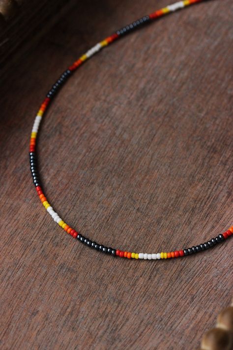 Dainty multicolored boho necklace with black hematite color,white,red,orange,yellow seed beads,silver tone clasps, strong nylon double thread, silver tone lobster claw and steel adjustable length chain. Perfect summer beach jewelry for everyday and a great gift! The length of chain is about 44 cm or 17.3 inches and 3.5 cm of adjustable length chain. Other necklaces of my shop you can see here: https://www.etsy.com/shop/NaTavelli?section_id=14843046&ref=shopsection_leftnav_5 Thanks for a visit Seed Bead Necklace Men, Seas Bead Necklace, Beach Seed Bead Necklace, Orange Seed Bead Necklace, Red Bead Necklace Ideas, Black Seed Bead Necklace, Western Seed Bead Necklace, Seed Beads Ideas, Western Beaded Jewelry