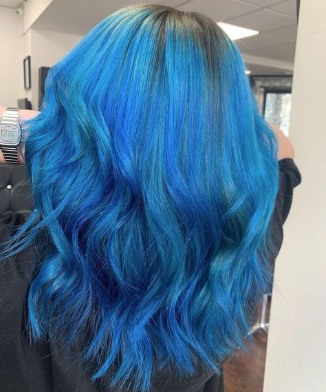 Bright blue hair with shadow root styled with slight waves Brown Roots Blue Hair, Shadow Root Blue Hair, Blue Hair With Shadow Root, Blue Hair Dye Colors Shades, Sky Blue Hair Dye, Dark Blue Roots Light Blue Hair, Bright Blue Hair Aesthetic, Bright Blue Hair, Blue Roots