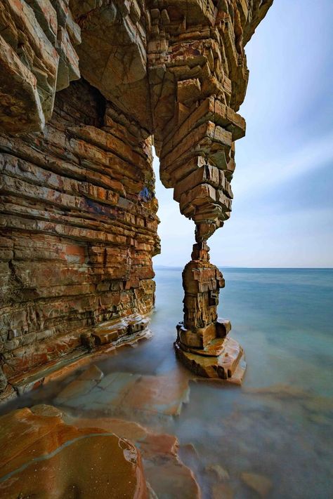 Table Leg Rock | This astonishing natural rock formation is located off the coast of Camel Mountain Landscape in China. Dalian, Table Leg, Natural Rock, Rock Formations, Bhutan, Amazing Places, A Rock, Mountain Landscape, Tibet