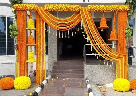 Marigold Entrance by Priti Nagpal. #housewarmingceremony #housewarming #houseparty #housedecor #homedecor #entrancedecor #homeentrancedecor #houseceremony #entrance #floralentrance #traditionalentrance #entrancedecor #marigoldentrance #marigolddecor House Decoration For Wedding Indian, Marigold Wedding Decoration, Marigold Flower Garland, Gate Decoration, House Warming Ceremony, Wedding Hall Decorations, Diwali Decorations At Home, Wedding Background Decoration, Wedding Entrance Decor