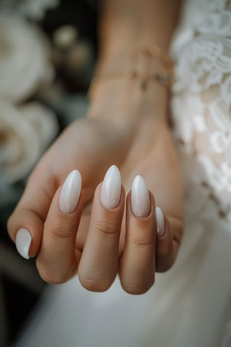 Accentuate your bridal chic with 40 stylish ombre nail designs, ensuring your wedding nails steal the spotlight. From subtle fades to vibrant transitions, these nail styles offer a modern twist on traditional bridal manicures. #ChicBride #NailPerfection Bridal Nails Neutral, Wedding Nails Ombré, Bride Nails Wedding Almond, Bridal Nail Designs Wedding Manicure, Bridesmaid Manicure Ideas, Wedding Nails Champagne Ivory, Bridal Almond Nails Wedding, Ivory Nails Wedding, Bride Nails Acrylic