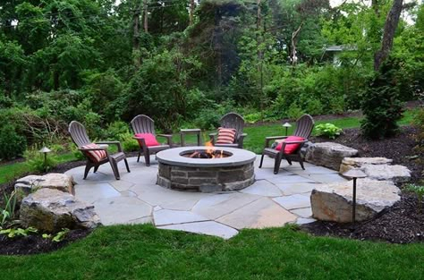 Perfect fire-pit towards the back of out property. Large Paver Fire Pit Area, Boulders Around Fire Pit, Fire Pit Cottage, Large Fire Pit Ideas, Stone Fire Pit Area, Flagstone Fire Pit Area, Rustic Fire Pit Ideas Backyard, Rustic Fire Pit Ideas, Flagstone Patio Design