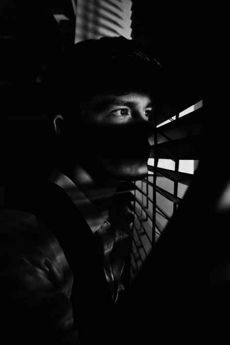 black and white film noir style man looking out a window Man Looking Out Window Aesthetic, Film Noir Photography Men, Quarterback Sneak, Hand Of Glory, Film Noir Photography, Biker Romance, Hungry Eyes, Photography Office, Window Photography