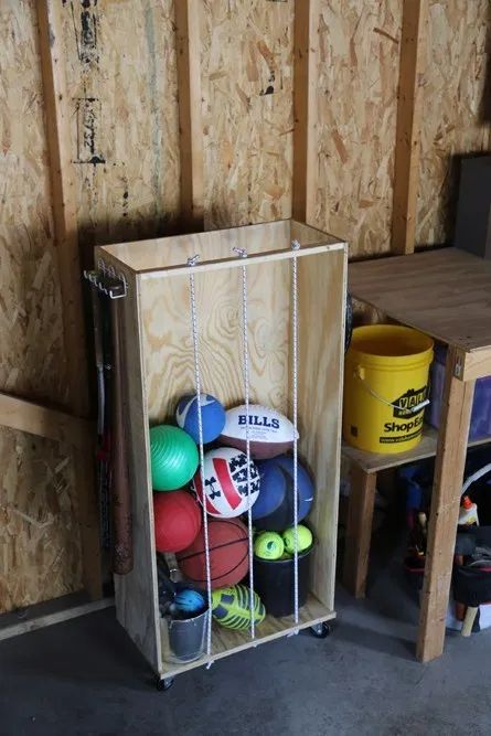 Solving the Sports Equipment Storage Dilemma – haus2home Diy Outdoor Toys, Sports Equipment Organization, Outdoor Toy Storage, Sports Equipment Storage, Gaming Aesthetic, Sports Storage, Workbench Plans Diy, Toys Ideas, Ball Storage