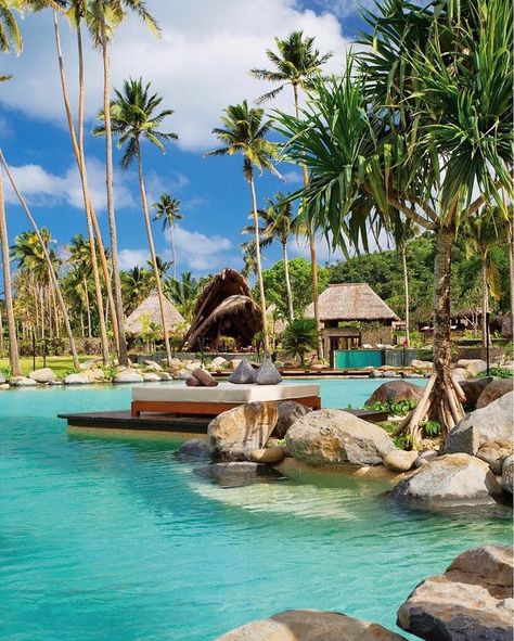 A luxurious destination on a private island in the South Pacific, Laucala Island Resort Fiji. The luxury resort is just a few steps away from the crystal clear blue waters surrounded by nothing but palm trees and coconut trees. A beautiful honeymoon destination Laucala Island, Private Island Resort, Tropical Resort, Resort Pools, Hotel Pool, Outdoor Swimming, Private Island, Island Resort, Beautiful Places To Travel