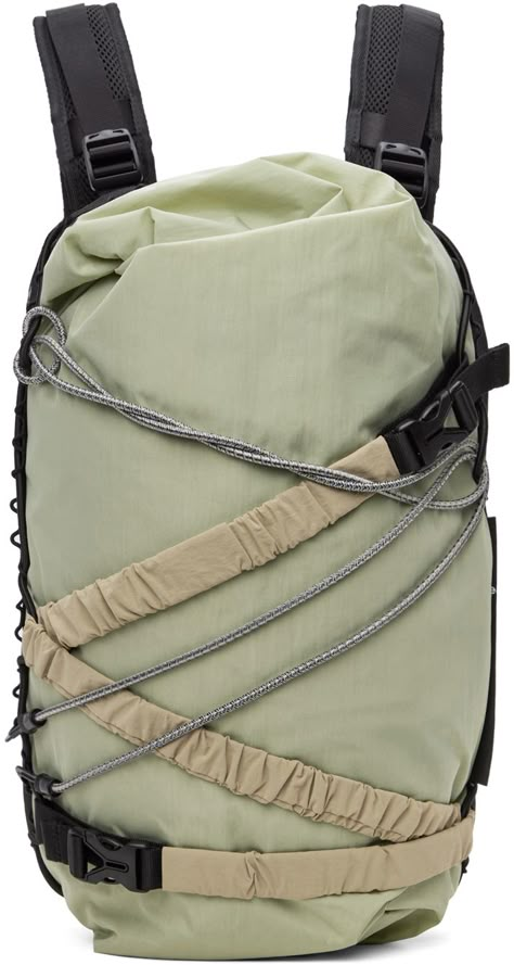 Recycled polyester canvas backpack in green. · Elasticized daisy chains throughout · Adjustable padded shoulder straps with sternum strap · Detachable elasticized compression strap at face · Detachable bungee cord at face · Zip pocket at side · Luggage strap at padded mesh back face · Two-way zip closure · Mesh patch pockets at interior · Padded laptop compartment · Twill lining · H17.5 x W11.5 x D3 Supplier color: Budgie green Backpack Design Concept, Backpack Inspiration, Daisy Chains, Urban Backpack, Rolltop Backpack, Unique Backpacks, Tech Backpack, Luggage Strap, Adventure Outfit