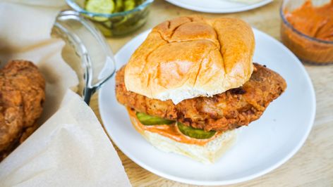 This copycat KFC chicken sandwich is jam-packed with crispiness. It's complete with a spicy sauce, pickles, and a brioche bun. Kfc Spicy Chicken, Kfc Chicken Sandwich, Copycat Kfc Chicken, Copycat Kfc, Kosher Dill Pickles, Chicken Sandwich Recipe, Kfc Chicken, Pickle Slices, Chicken Sandwich Recipes