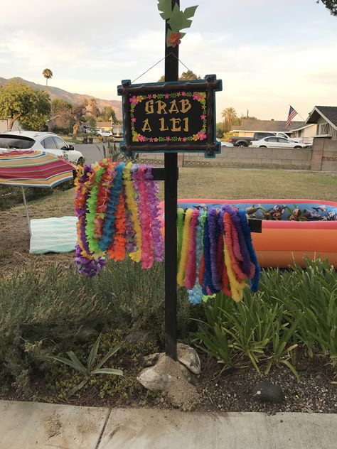 Grab a lei stand I made with two pieces of wood from home depot, stained them and nailed together Lei Stand For Party, Lei Stand, Luau Decor, Luau Pool Party, Moana Theme Birthday, Luau Decorations, Moana Theme, Luau Birthday Party, Flower Lei