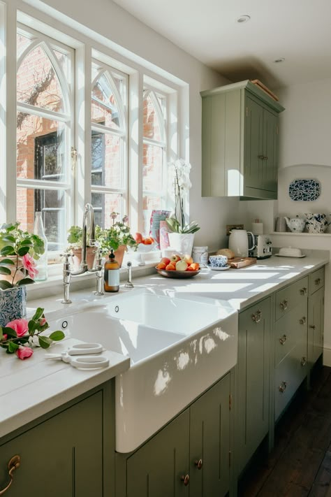 The fantasy of the rustic kitchen persists in town and country alike. Fashion and lifestyle journalist Louise Roe’s cottagecore kitchen features Caesarstone 5000 London Grey work surface, from £550 per square metre, caesarstone.co.uk and cabinets by British Standard by Plain English, from £8,000, britishstandardcupboards.co.uk England Kitchen, Georgian Farmhouse, Kitchen Cupboards Paint, Sage Green Kitchen, Renovated Kitchen, Green Kitchen Cabinets, Farmhouse Style Kitchen, Cottage Kitchen, Green Kitchen