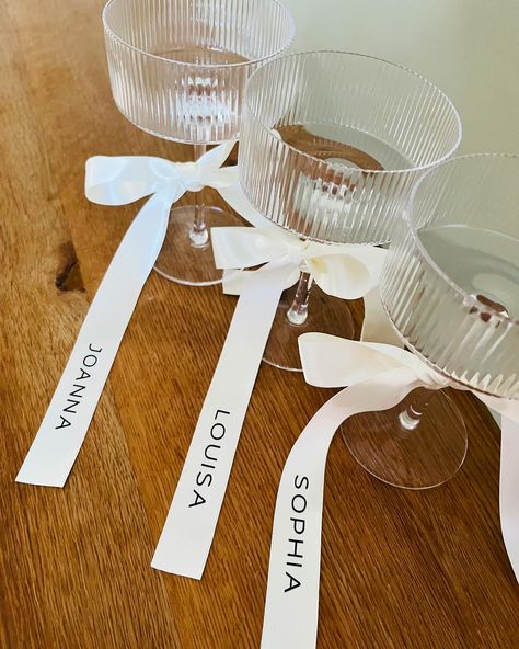 Champagne Coupe Glass & Personalised Ribbons - Now available. A large range of bow colours to suit your wedding theme 🥰 #bridesmaidproposal #bride #bridestobe #brides2025 #bridesmaidglass #brideglass #bridesofinstagram #bridestyle #bridesofuk #proposalbox #bridetribe #bridetrends #bridetribe💍 Ribbon On Glasses, Bridesmaid Box Gifts, Bridesmaid Morning Of Wedding Gift, Bridesmaid Boxes What To Put In A, Gifts For Bridesmaids On Wedding Day, Aspen Bachelorette, Bridesmaids Proposal Ideas, Bridesmaid Proposal Box Ideas, Luxury Bridesmaid Gifts