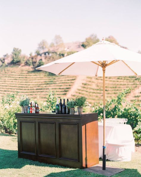 Premiere Party Rents on Instagram: “Our Florence Bar beneath our Market Umbrella 😍 || Planning + design: @smithjamesevents | Photography: @sallypineraphoto | Floral Design:…” Beverage Bars, Wedding Recovery, Wedding Bar Decor, Purple Instagram, Staging Furniture, Africa Wedding, White Umbrella, Eclectic Wedding, Umbrella Wedding