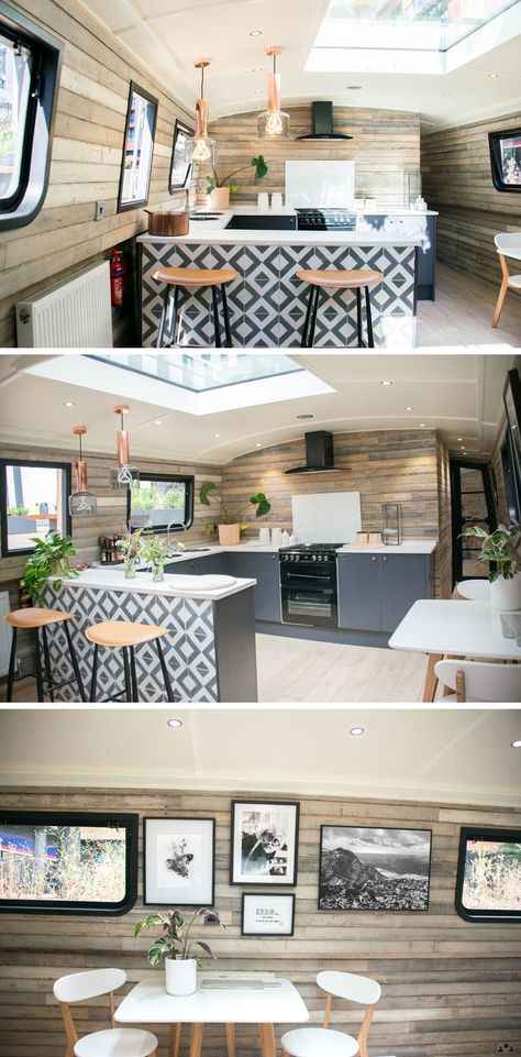 In the kitchen of a modern boathouse, an patterned tile accent designates the bar area of the kitchen, and on the adjacent wall, there's a small dining space for two. A skylight allows the natural light from above to filter through to the interior. #KitchenDesign #Boathouse Modern Boathouse, Barge Interior, Backsplash Accent, Narrowboat Interiors, Boat House Interior, Boat Interior Design, Reclaimed Wood Paneling, Dutch Barge, Patterned Tile