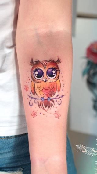 Owl Tattoos - Their Meaning Plus 14 Stunning Examples Small Tattoo Ideas Colorful, Owl Tattoo Cartoon, Owl Tattoo With Color, Baby Owl Tattoo For Women, Owl Heart Tattoo, Owl Family Tattoo For Women, Mother Daughter Owl Tattoos, Owl Wrist Tattoos For Women, Owl Tattoo Cute