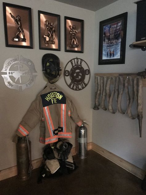 Firefighters display, fire hose Firehouse Playhouse, Firefighter Display, Firehouse Decor, Fireman Room, Firefighter Bedroom, Fire Hose Crafts, Firefighter Man Cave, Firefighter Room, Craft Diy Ideas