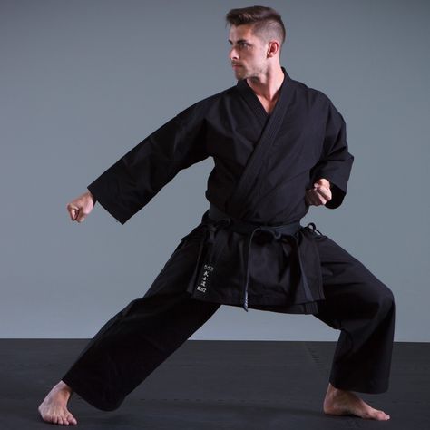 Black Challenger Karate Suit: A professional heavyweight suit for champions. The 14oz (400gsm) 100% club cotton canvas suit has strong jacket ties and the long jacket stops any riding up. Additional strength comes from the extra stitching in the under arm and gusset. The pants come with traditional tie waist. Belt not included. Uniforms Outfits, Black Challenger, Karate Suit, Karate Outfit, Karate Gi, Action Pose Reference, Action Pose, Cyberpunk Fashion, Senior Pics