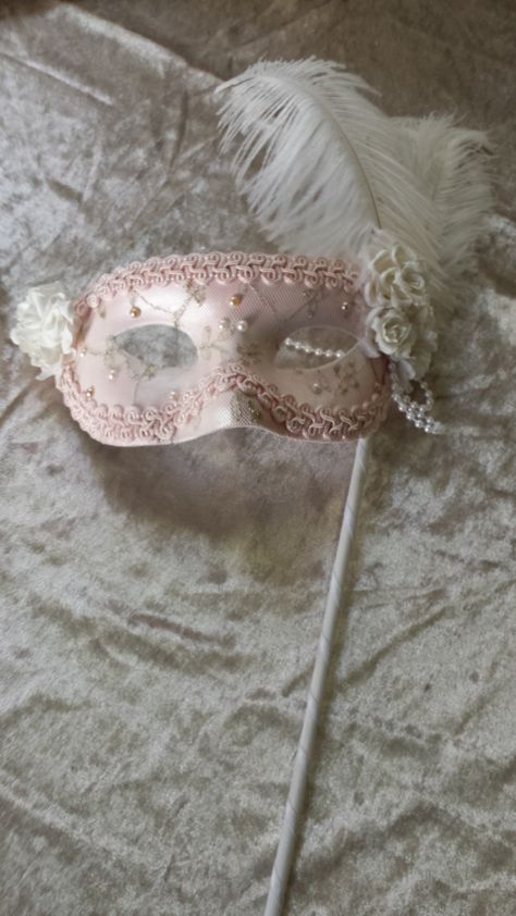 Hand made Masquerade Venetian Style Eye Mask Soft pink base with gold thread lace overlay embellished with pearls, hand made paper flowers and feathers and side pearl drop.  Decorated hand wand. Ideal for brides, masquerade balls, fashion parades or simply display as an art piece Pink Masquerade Ball, Masquerade Ball Ideas, Masquerade Quinceanera Ideas, Masquerade Mask Aesthetic, Lace Mask Masquerade, Pink Masquerade Mask, Pink Masquerade, Senior Events, Hand Wand