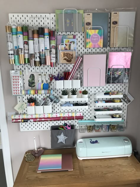 🥰I finally have my ikea peg board system set up and i love it 🥰 I’ve been buying pretty stationary to fill it 🙊❤️! #Skäddis #ikea #ikeastorage #pegboard. Next up I need a new desk as this is too small to use my Cricut crafting machine #cricutexploreair #cricut Ikea Stationary Storage, Peg Board Cricut Organization, Ikea Peg Board Craft Room, Cricut Pegboard, Small Business Desk Set Up, Peg Board Small Business, Cricut Set Up Desk, Peg Boards, Cricut Pegboard Organization