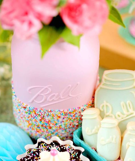 Sprinkle mason jars at a country chic bridal shower party! See more party planning ideas at CatchMyParty.com! Sprinkle Mason Jars Diy, Sprinkle Bridal Shower Ideas, Sprinkle Centerpiece Ideas, Sprinkle Centerpieces, Wedding Bridal Party Table, Country Chic Bridal Shower, Country Bridal Shower Decorations, Bridal Party Table Decorations, Shabby Chic Wedding Cake