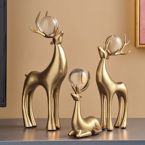 The sculpture lets you add a nice touch to your holiday decor. In ornate detailing and with a lavish gold finish, these reindeer ornaments are crafted from fine-quality resin. Perfect to adorn any living room or dining area at Christmas, they really evoke festivity and can bring elegance into a home ambiance. 3-pieces set with different shapes High-quality resin materials Reindeer sculpture crystal ball decoration Can be placed both indoor and outdoor Animal Statues Decor Living Rooms, Reindeer Decor, Reindeer Statue, Reindeer Sculpture, Joy Decorations, Indoor Holiday Decor, Minimalist Christmas Decor, Diy Christmas Decorations For Home, Classy Christmas