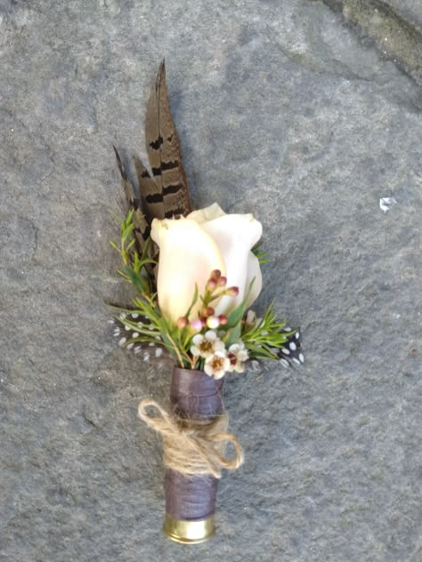 Boutineers With Feathers, Boutineer With Duck Feather, Centerpieces Wedding Country, Wedding Flowers With Feathers, Duck Call Boutonniere, Shotgun Boutineers, Western Boutineer, Shotgun Shell Boutineer, Shotgun Shell Boutonniere Diy