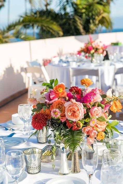 a colorful summer wedding centerpiece of hot pink, orange, light pink, red blooms and foliage is amazing Orange Wedding Centerpieces, Orange Centerpieces, Summer Wedding Centerpieces, Orange And Pink Wedding, Bright Wedding Flowers, Orange Wedding Flowers, Hot Pink Weddings, Summer Centerpieces, Boda Mexicana