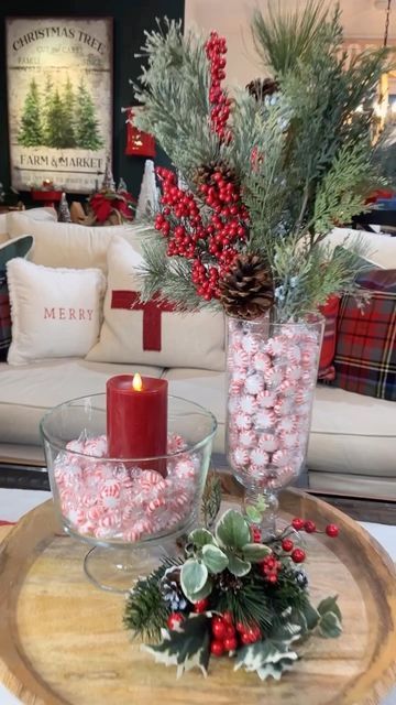 Jodie | Baking, Seasonal Decor & DIY on Instagram: "This simple peppermint centerpiece is so easy to make— and it’s perfect for a coffee table, kitchen island or anywhere in your 🎄home! All you need is: A glass bowl or trifle dish like this. A festive candle for the center. Some peppermint candies. For the tall vase: Insert a slightly narrower vase in the center that leaves just an inch to 1/2 inch around all the sides. Fill with peppermint candies. Add real or faux holiday greens with h Christmas Candy Bowls, Peppermint Table Decor, Peppermint Christmas Centerpiece, Peppermint Porch Decor, Peppermint Centerpieces, Trifle Bowl Decor, Side Table Christmas Decor, Cranberries Decor, Peppermint Decor