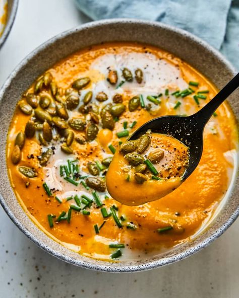 Carrot Ginger Soup Recipe (Creamy) | Kitchn Soup Carrot, Carrot Ginger Soup Recipe, Thanksgiving Soups, Shelled Pumpkin Seeds, Fennel Soup, Vegetarian Ideas, Creamy Cauliflower Soup, Carrot Ginger Soup, Ginger Soup