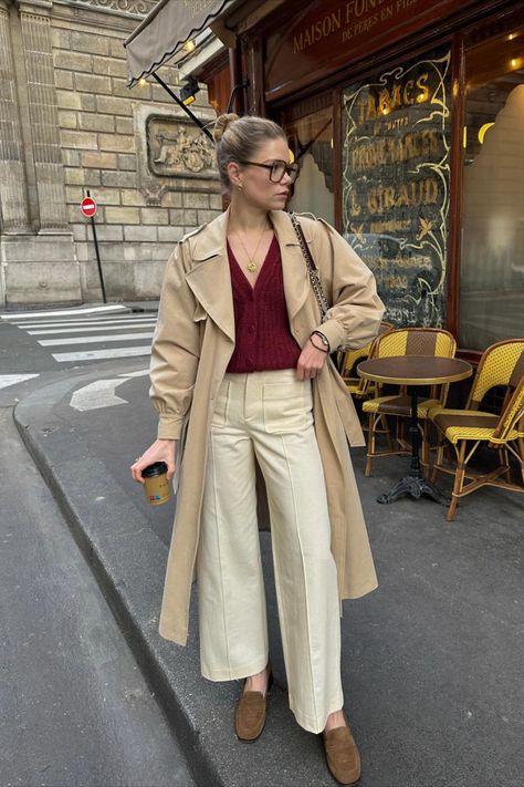 @elodieromy is wearing the Sézane Emilio trousers paired with a plum cardigan, timeless trench, and loafers. The perfect spring Parisian-style outfit! We love to see how you all style our Sézane essentials. Sezane Cardigan Outfit, Spring Parisian Style, Elodie Romy, Beige Trousers Outfit, Sezane Outfit, Parisian Chic Outfits, Wide Leg Trousers Outfit, Parisian Style Outfit, Trousers Outfit