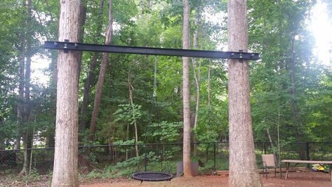 Swing between two trees using metal I beam Swings Between Two Trees, Shade Landscaping, Outdoor Fun For Kids, Urban Farm, Redwood Tree, Tree Swing, I Beam, Two Trees, Aerial Silks