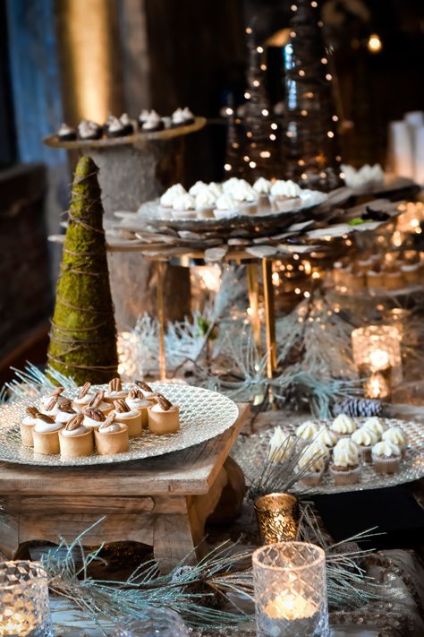 Need to spice up a dessert table for a winter wedding? Displaying candles, miniature trees, wooden accents, and frosted pine branches creates a beautiful, wintry dessert table! | Pretty + Planned Events | Visit prettyandplanned.com today to start the wedding planning process. Together, we can plan something pretty! | Photographer: Picture this Studio | Dessert Table Ideas Christmas, Winter Wedding Food Stations, Winter Dinner Decorations, Christmas Dinner Buffet Table, Dessert Table Christmas, Winter Buffet Table Decor, Dessert Bar Christmas, Holiday Party Dessert Table, Dessert Table Aesthetic