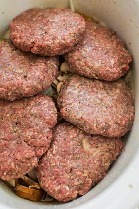 A favorite family meal this easy Salisbury steak recipe is made in the slow cooker making it an easy weeknight dinner Slower Cooker Salisbury Steak, Crockpot Salisbury Steak With Hamburger Patties, Hamburger Meat In Crockpot Recipes, Healthy Trucker Meals, Ground Hamburger Crockpot Recipes, Crockpot Salsberry Steaks, Crockpot Hearty Meals, Slow Cooker Hamburger Steaks, Hamburgers In Crockpot