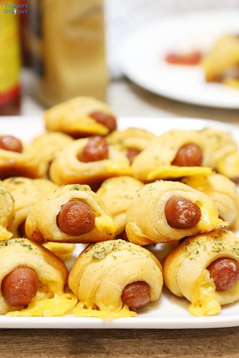 Crescent Roll Pigs in a Blanket with Garlic Herb Butter are Lil’ Smokies or mini hot dogs and cheese wrapped in crescent roll dough and brushed with garlic herb butter sauce. For recipe and more, visit todaysdelight.com Mini Smokies Recipes, Pigs In A Blanket Recipe With Hot Dogs, Smokies Crescent Rolls, Lil Smokies Crescent Rolls, Little Smokies Crescent Rolls, Mini Hot Dog Recipes, Garlic Herb Butter Sauce, Mini Pigs In A Blanket, Cresant Rolls