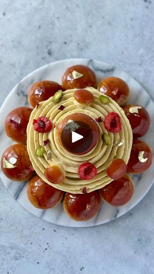 21K views · 2K reactions | (Recipe) Tourbillon Raspberry Pistachio St. Honoré 🌀 - Beware, this is gourmand and addicting! My two favorite flavors in multiple textures combined in an indulgent dessert with all of the praliné. 
Applying the 🌀 technique by @yannbrys here was fun. 

Composition:
- Choux with craquelin, recipe in my blog
- Pâte sucrée base
- Raspberry cremeux, recipe in previous post
- Pistachio whipped ganache
- Pistachio praliné 
- Raspberry confit 
- 
PISTACHIO PRALINÉ 
150g roasted pistachios, unsalted
125g granulated sugar
25g glucose syrup (or light corn syrup)
40g water
QS grape seed oil (or vegetable oil)

PISTACHIO WHIPPED GANACHE 
125g heavy cream (1) 
30g invert sugar (e.g., light corn syrup) 
75g white chocolate, high quality 
50g pistachio praliné
25g pistachio p Cremeux Recipe, Craquelin Recipe, Raspberry Confit, Raspberry Pistachio, Roasted Pistachios, Whipped Ganache, Indulgent Desserts, Grapeseed Oil, Granulated Sugar