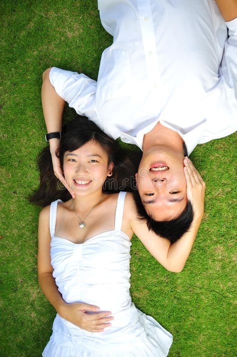 Couple In Love Lying On The Grass. Asian Couple In Love Spending Time In The Par #Sponsored , #sponsored, #SPONSORED, #Love, #Grass, #Time, #Lying Grass Drawing, Lovers Images, Asian Couple, Grass Painting, People Lie, Image Couple, Couple In Love, Body Reference Poses, Couples Images