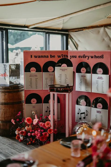 Pink Festival Disco Theme Wedding At Hadsham Farm With DIY Disco Ball Arch with pink colourful wedding table plan signage with vinyl records, vintage record player and pink wedding flowers Disco Theme Wedding, Wedding Seating Plan Ideas, Wedding Breakfast Seating, Ball Arch, Vinyl Record Wedding, Music Theme Wedding, Emo Wedding, Seating Plan Ideas, Record Wedding