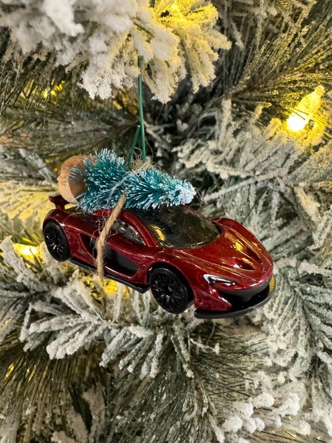 This is a custom made McLaren P1 carrying a Christmas Tree Ornament made from a Hot Wheel. Perfect for the holiday season! Mclaren P1 Red, Bugatti Chiron Black, Lego Wall, Mclaren P1, Hot Wheel, Christmas Decoration Items, Tree Christmas, Christmas Tree Ornament, How To Make Ornaments