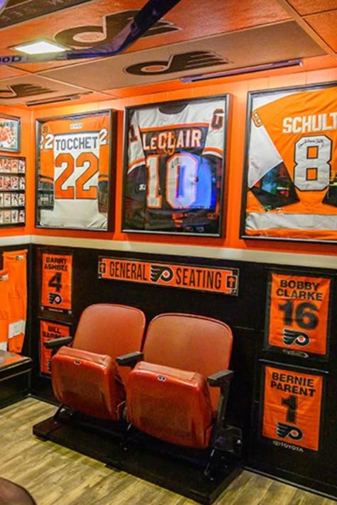 Football Theater Room, Hockey Shadow Box Ideas, Man Cave Basement Sports, Video Game Man Cave, Hockey Memorabilia Display, Sports Memorabilia Room, Hockey Man Cave, Sports Cave, Teen Hangout Room