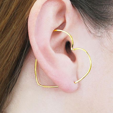 Love the look of multiple piercings, but don’t want to go through the effort? Check out Otis Jaxon‘s ear climbers... Gold Ear Cuffs, Heart Ear Cuff, Rose Gold Ear Cuff, Silver Ear Cuff Earrings, Minimalist Ear Cuff, Gold Ear Jacket, Silver Ear Climbers, Edgy Earrings, Geometric Hoop Earrings