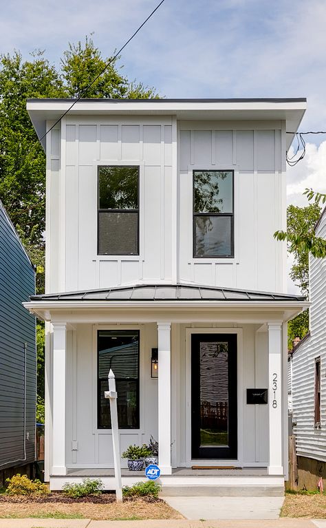 Narrow lot home This home is only 15 ft. wide so keeping the floor plan open and the design as as light and bright as possible was very important. We kept the exterior style of the home similar to the other homes on this block but we added the board and batten siding, white exterior paint, and black windows to give it an updated and on trend look. We made the front porch low to the ground to also give the home some southern charm #narrowlot #narrowhome #tinyhome #tinyhomes Small Tall House Design, Narrow House Kitchen, Tall Homes For Small Lots, Open Concept Narrow House, Small House Plans Under 1000 Sq Ft Narrow Lot, Narrow Lot Modern House Plans, Narrow Tiny House Plans, 15 Ft Wide House Plans, Narrow Deep Lot House Plans