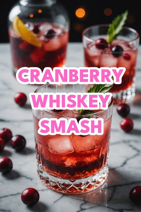 A photo of a  Cranberry Whiskey Smash which is a type of Christmas whiskey cocktails Ginger Cranberry Whiskey Cocktail, Jack Daniels Apple And Cranberry, Bourbon Cranberry Cocktail, Christmas Cocktail Whiskey, Winter Whiskey Drinks, Pecan Whiskey Drink Recipes, Christmas Whisky Cocktails, Whiskey Holiday Cocktail, Cranberry Bourbon Cocktail