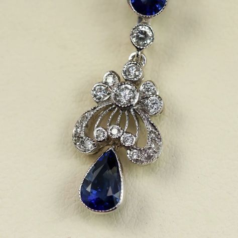 This Edwardian inspired 18k white gold pendant features a pear shape and a round blue sapphire accented by 18 round brilliant cut diamonds – sku: 235-01834 . . . . . . . #edwardian #vintageinspired #somethingblue #sapphirenecklace White Gold Pendant, Sapphire Necklace, Something Blue, Round Brilliant Cut Diamond, 14kt Gold, Victorian Era, Pear Shape, Pear Shaped, Round Brilliant