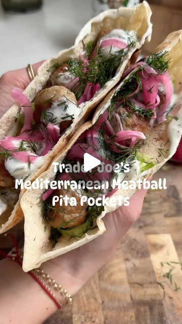 Jordan Zelesnick on Instagram: "🥙 Mediterranean Meatball Pita Pockets 🥙  Meal prep a week’s worth of lunches in under 20 minutes 😮  If you want more easy Trader Joe’s recipes like this one, comment “cookbook” and I’ll send you the link to grab a copy of my Trader Joe’s cookbook!  Ingredients: Trader Joe’s party meatballs Pita Romaine lettuce, finely chopped Pickled onions Tzatziki Fresh dill  Instructions: Cook the meatballs according to package instructions.  While they’re cooking, heat the pita over the open flame on your stove to toast it. Slice it in half, then fill with the lettuce, meatballs, tzatziki, pickled onions, and dill.  #pitapockets #pitasandwich #meatballsandwich #traderjoesrecipes #traderjoesmeals #traderjoesfinds   https://urlgeni.us/amzn/ncB4E" Meatballs Tzatziki, Meatball Pita, Mediterranean Meatballs, Party Meatballs, Pita Sandwiches, Meatball Sandwich, Pita Pockets, Trader Joes Recipes, Food Motivation