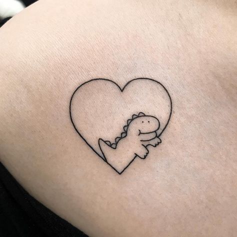 Dinosaur heart tattoo Mom And Daughter Dinosaur Tattoo, Dinosaur Best Friend Tattoos, Friend Dinosaur Tattoos, Dinosaur Heart Tattoo, Small Dinosaur Tattoo Cute, Cartoon Dinosaur Tattoo, Tattoo Dino, Tattoo Dinosaur, Anniversary Tattoos