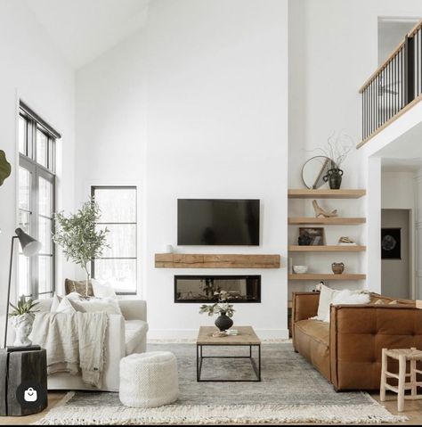 Modern Staircase Chandelier, Wall Shelves Living Room, Brown Leather Couch, Staircase Chandelier, Cube Ottoman, Modern Staircase, Leather Couch, Living Room Inspo, Couches Living Room