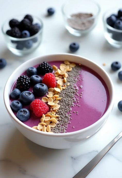 A close-up of a vibrant purple smoothie bowl topped with fresh berries, granola, and chia seeds on a marble countertop. Berry Acai Bowl, Acia Bowls, Food Cleanse, Raw Food Cleanse, Berry Smoothie Bowl, Fruit Bowls, Smoothie Bowls, Berry Smoothie, Nutritious Breakfast