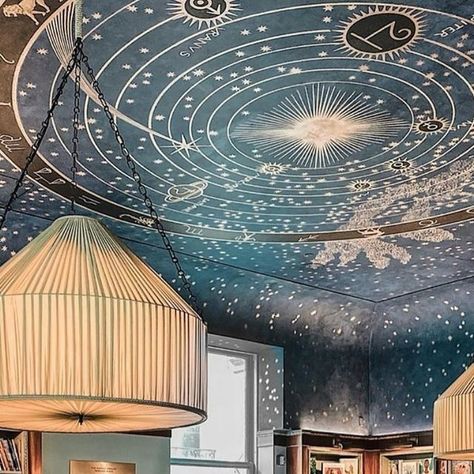 One Thousand Libraries 📖 on Instagram: "Welcome to Albertine Books is a magical bookstore located in the historic Payne Whitney Mansion on Fifth Avenue in New York City. It was founded in 2014 by the Cultural Services of the French Embassy. 

One of the most captivating features of Albertine Books is its celestial ceiling mural in the reading room, designed by artist Etienne Baudet. This stunning artwork depicts constellations and celestial imagery, creating a serene and inspiring atmosphere for readers.

Albertine Books is open seven days a week with the following hours:

- Monday to Saturday: 11:00 AM - 6:00 PM
- Sunday: 11:00 AM - 5:00 PM

📸: @danieltriassi 

#albertinebooks #nyc #bookshop #bookshopsofinstagram" Magical Bookstore, Celestial Ceiling, Ceiling Mural, Ravenclaw Aesthetic, Reading Room, Ravenclaw, House Inspo, Dream Room, 인테리어 디자인