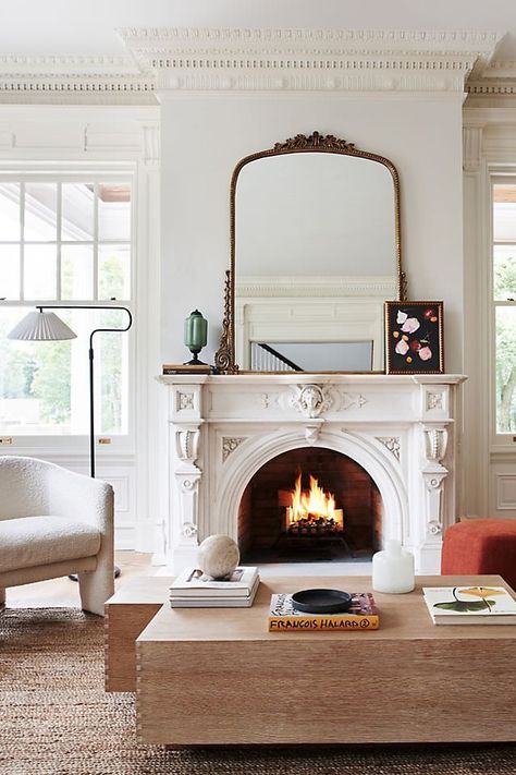 The Anthropologie mirror is basically social media famous, and I found the best Anthropologie mirror dupes online with the same antique look. Vintage Mirror Above Fireplace, Brass Mirror Above Fireplace, New Orleans Decor Interiors Living Room, Mirrors Over Couch Living Rooms, Gold Vintage Living Room, Large Mirror Over Fireplace Living Room, Dark Academia Fireplace Mantle, Mirror In Fireplace, Large Mirror Over Fireplace