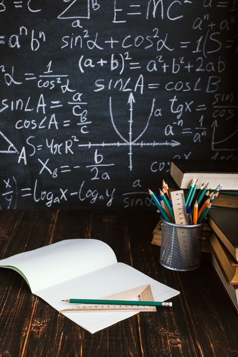 School desk in classroom, with books on background of chalk board with written formulas. Background For Education, School Classroom Background, Teacher Background, Background School, Classroom Background, Photo School, School Card, Gold Foil Balloons, First Birthday Cards