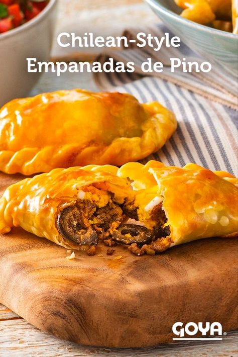 Prepare these delicious and flaky Chilean-Style Empanadas de Pino, a staple of Chilean cuisine, at home. This recipe is made with the convenient and practical GOYA® Empanada Dough-Criollas for Baking and Frying, and filled with a savory combination of ground beef, black olives, raisins and sliced hard-boiled eggs. Serve with pebre, the traditional sauce that enhances their incredible flavor. Empanadas Argentinas Recipe, Empanada Filling, Baked Empanadas, Pasties Recipes, Raisin Recipes, Empanadas Dough, Venezuelan Food, Chilean Recipes, Beef Empanadas